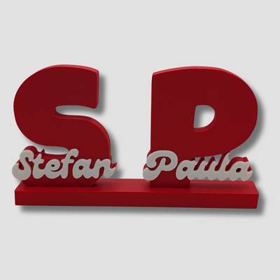 Red decorative nameplate with 'Stefan' and 'Paula' on a white background