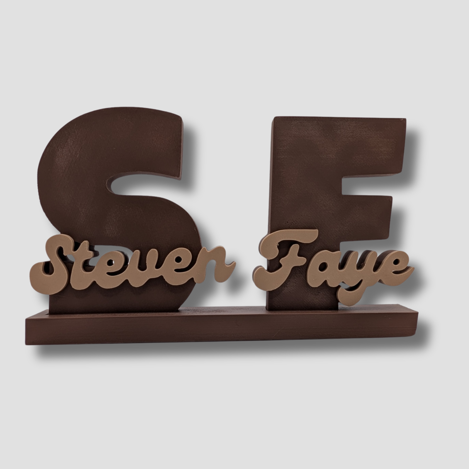 Decorative nameplate with 'Steven Faye' on a plain background