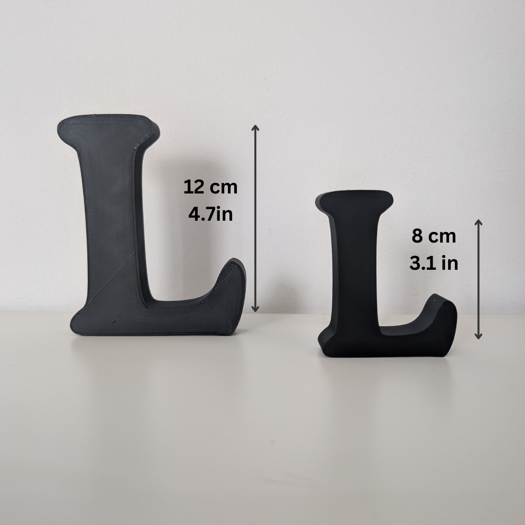 Two black letter 'L' shapes with measurements on a white background
