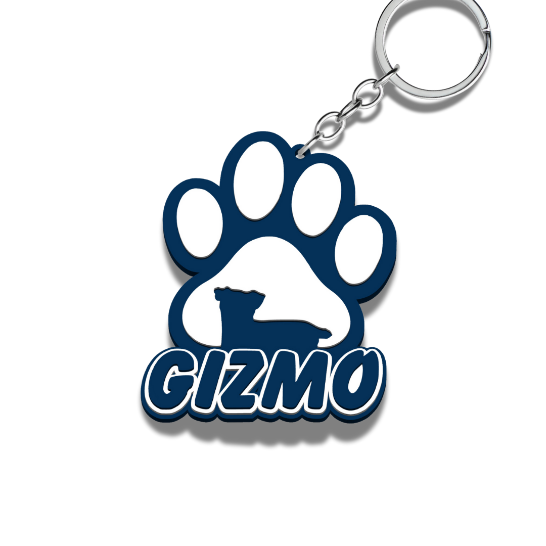 Keychain with paw print design and 'GIZMO' text on a white background