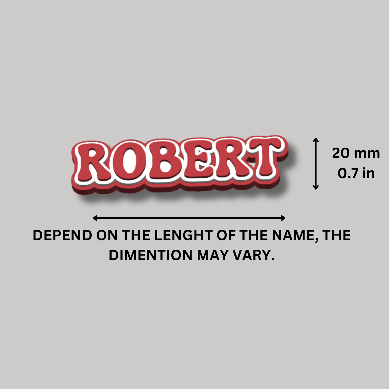 Close-up of a red and white layered fridge magnet with the name 'ROBERT', showing dimensions ($20 \text{ mm}$ high).