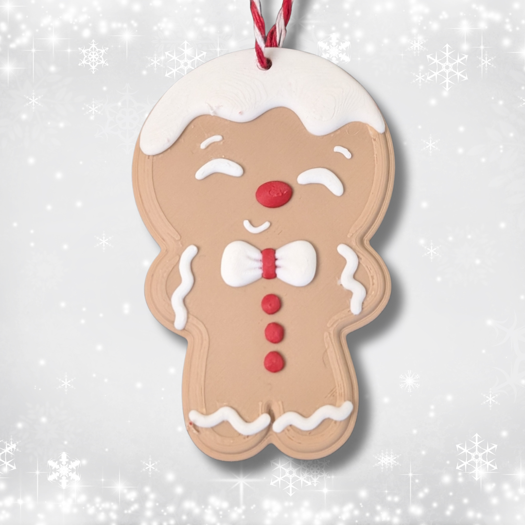 Close-up of a smiling Gingerbread Man Christmas ornament with a red and white hanging thread.