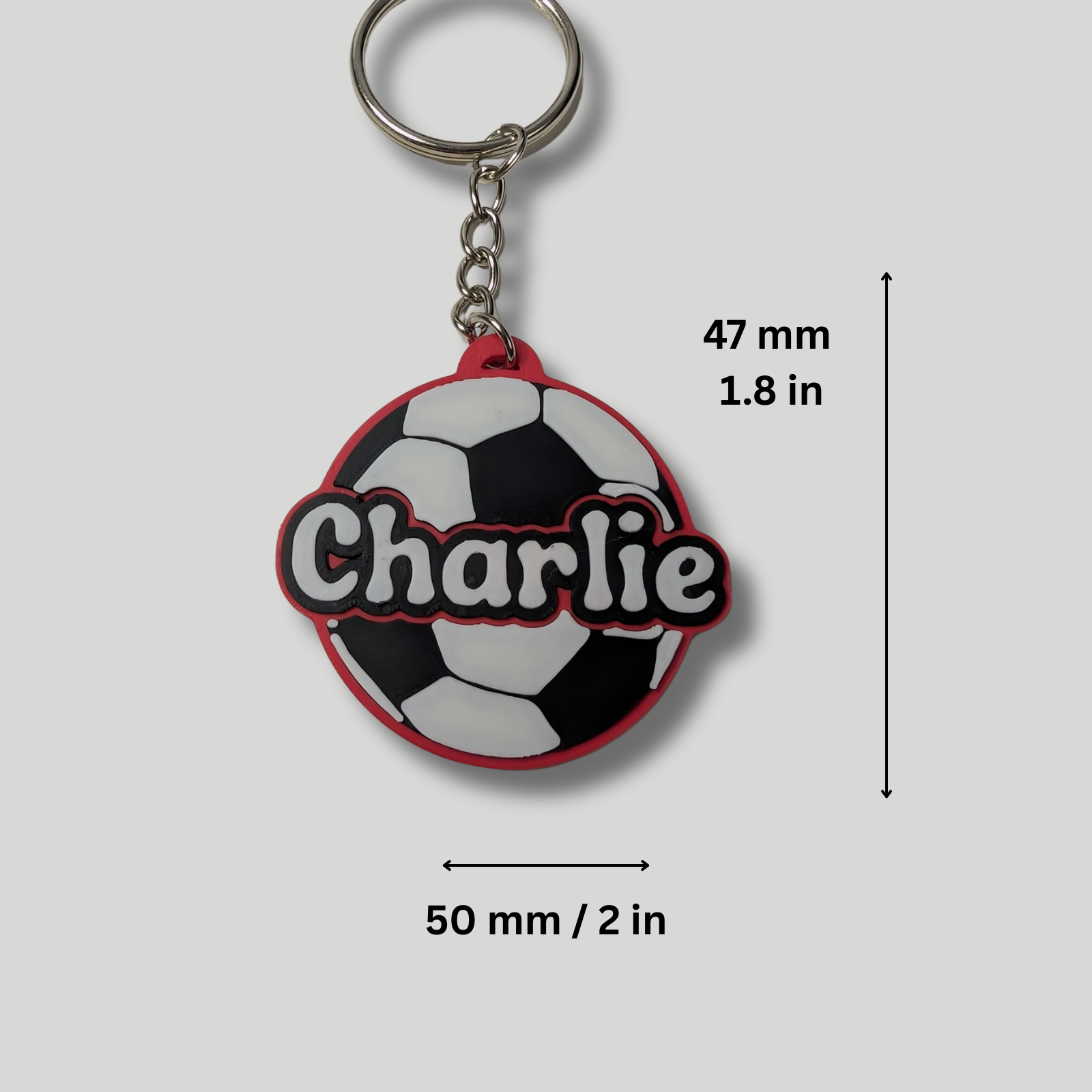 Keychain with soccer ball design and 'Charlie' text, shown with measurements.