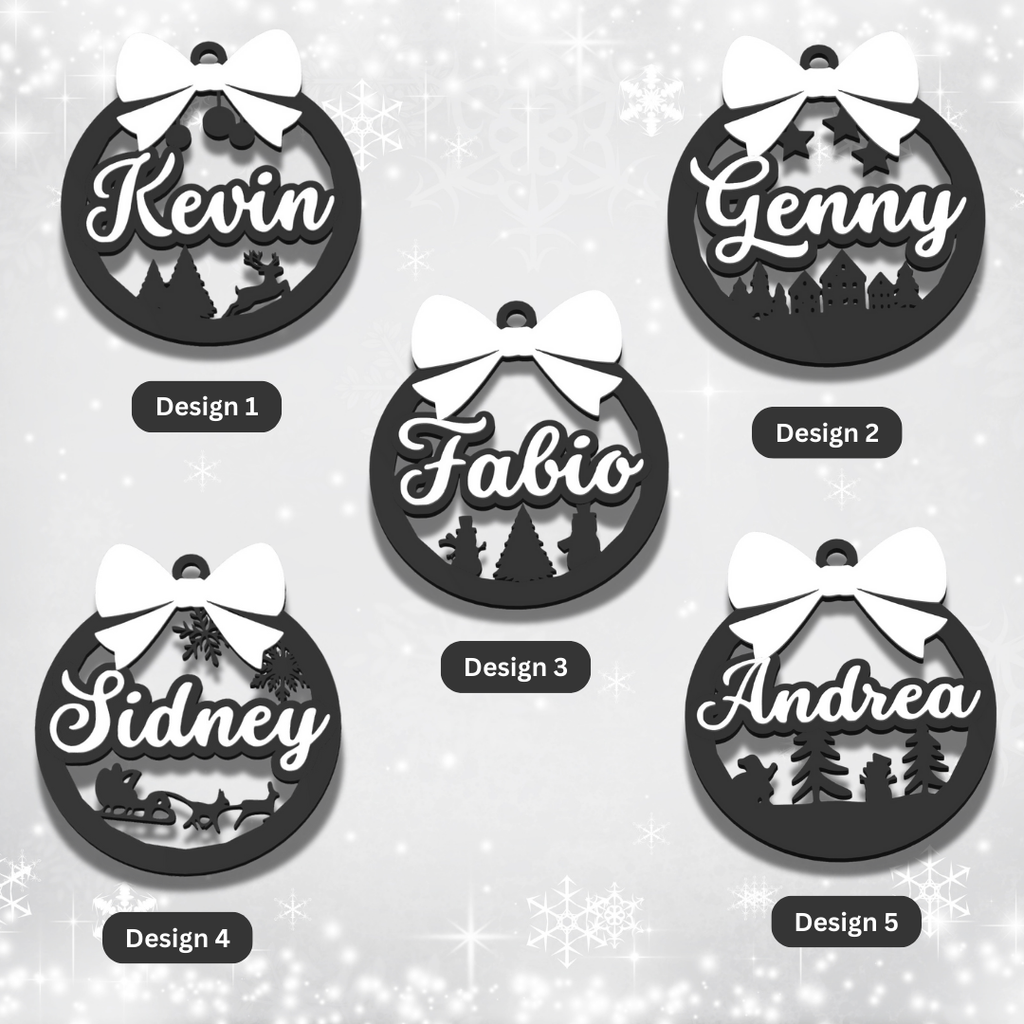 Set of personalized black Christmas ornaments with names on a light gray background
