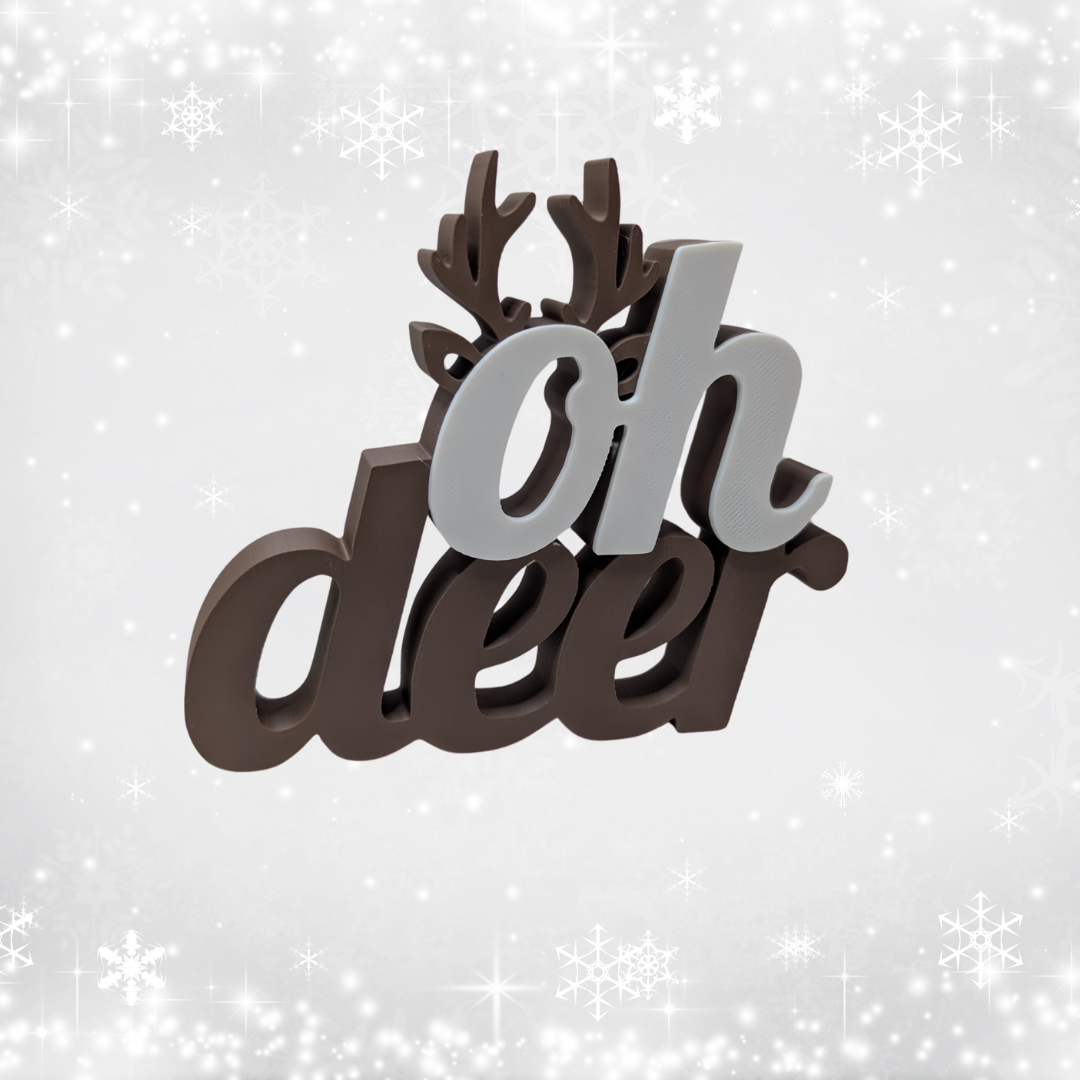 Decorative sign with 'oh deer' text and antlers on a snowy background