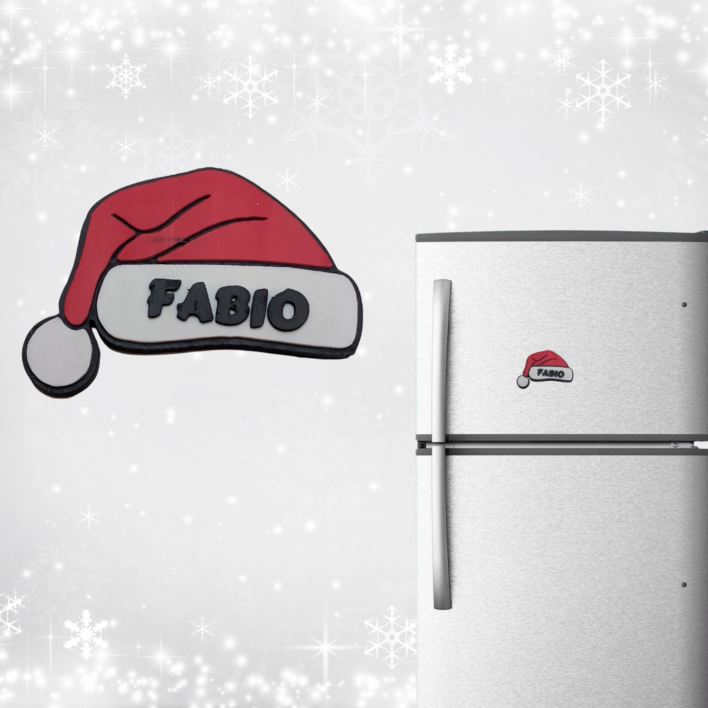Fridge with a 'Fabio' Santa hat magnet on a snowy background