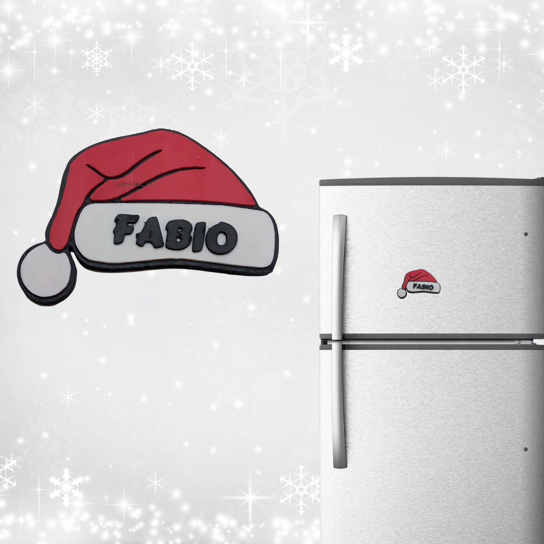 Fridge with a 'Fabio' Santa hat magnet on a snowy background