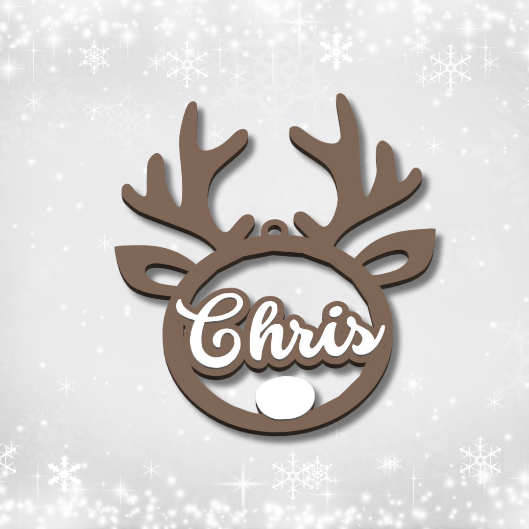 Decorative reindeer head ornament with 'Chris' on a snowy background