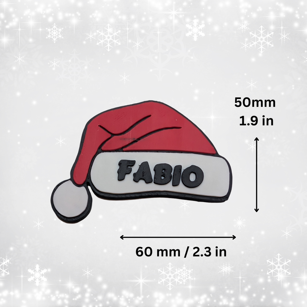 Red Santa hat with 'FABIO' text and measurements on a light gray background