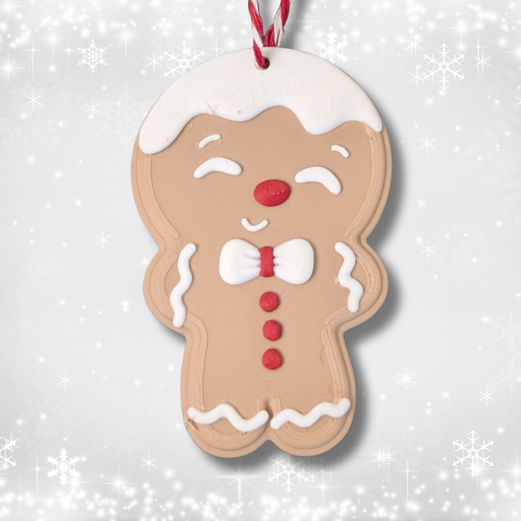 Close-up of a smiling Gingerbread Man Christmas ornament with a red and white hanging thread.